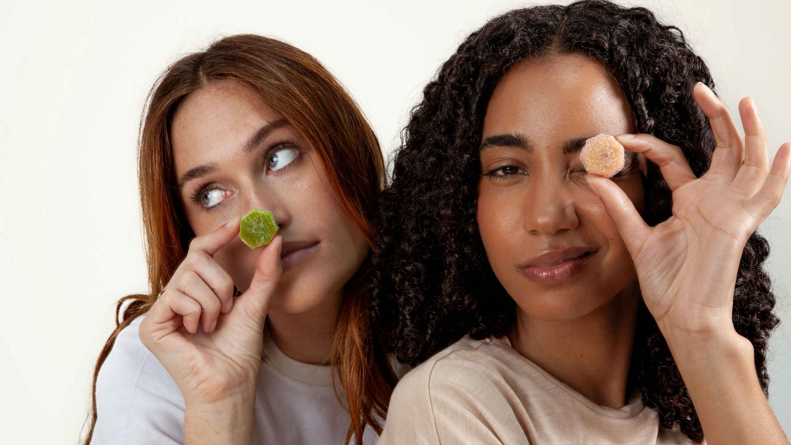 Two women holding Elo Smart Gummies